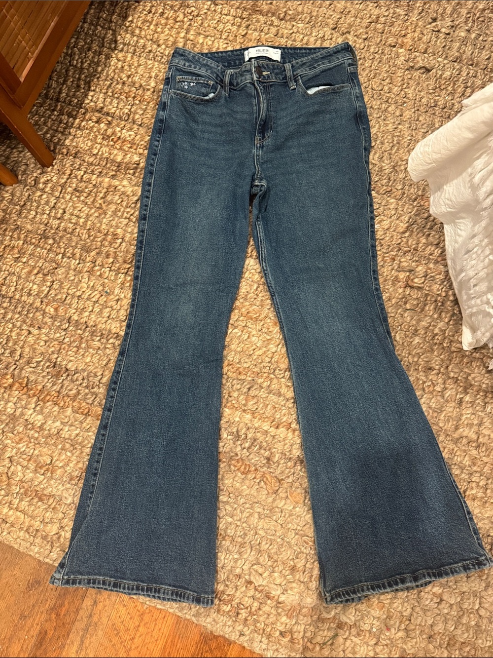 Hollister flare pants with flower embroidery.